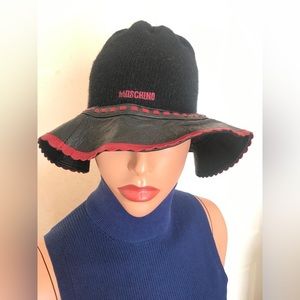 Moschino black cashmere and leather hat with red trip & accent button. Worn once